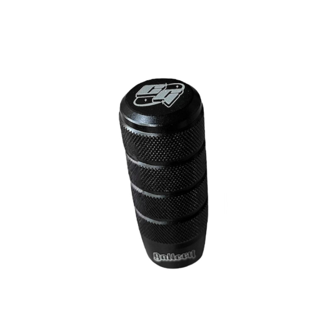 Custom shift knob and gear shift knob with laser engraved logos gear stick on a black background