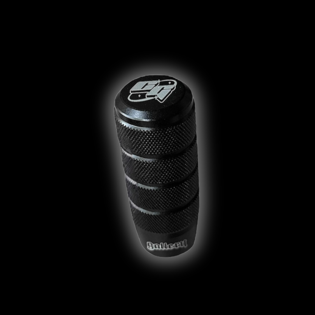 Custom shift knob and gear shift knob with laser engraved logos gear stick on a black background