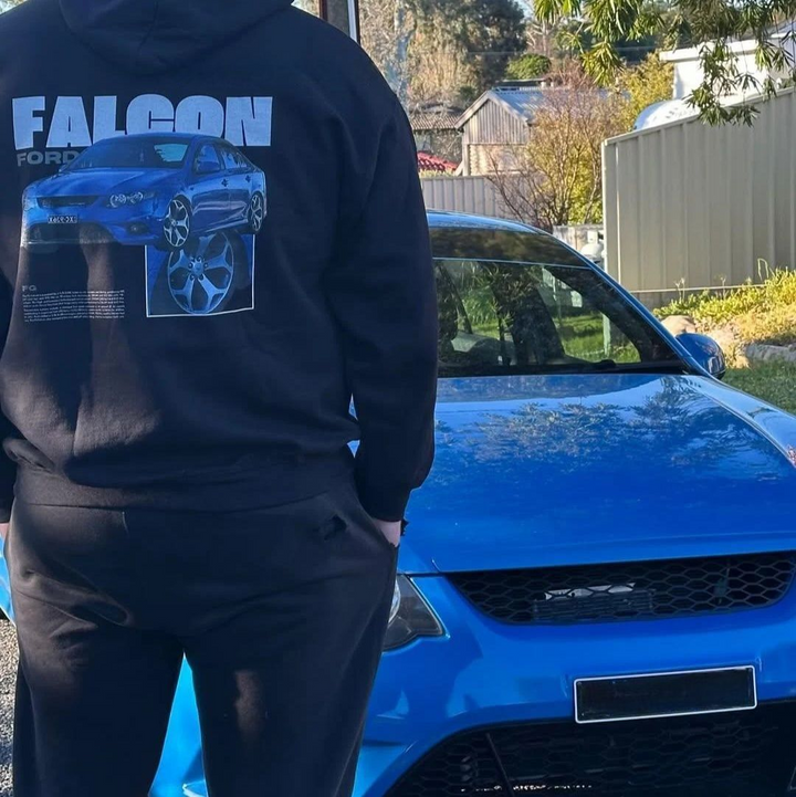Customer wearing our custom car Hoodie featuring their Ford Faclon, photographed next to their car.