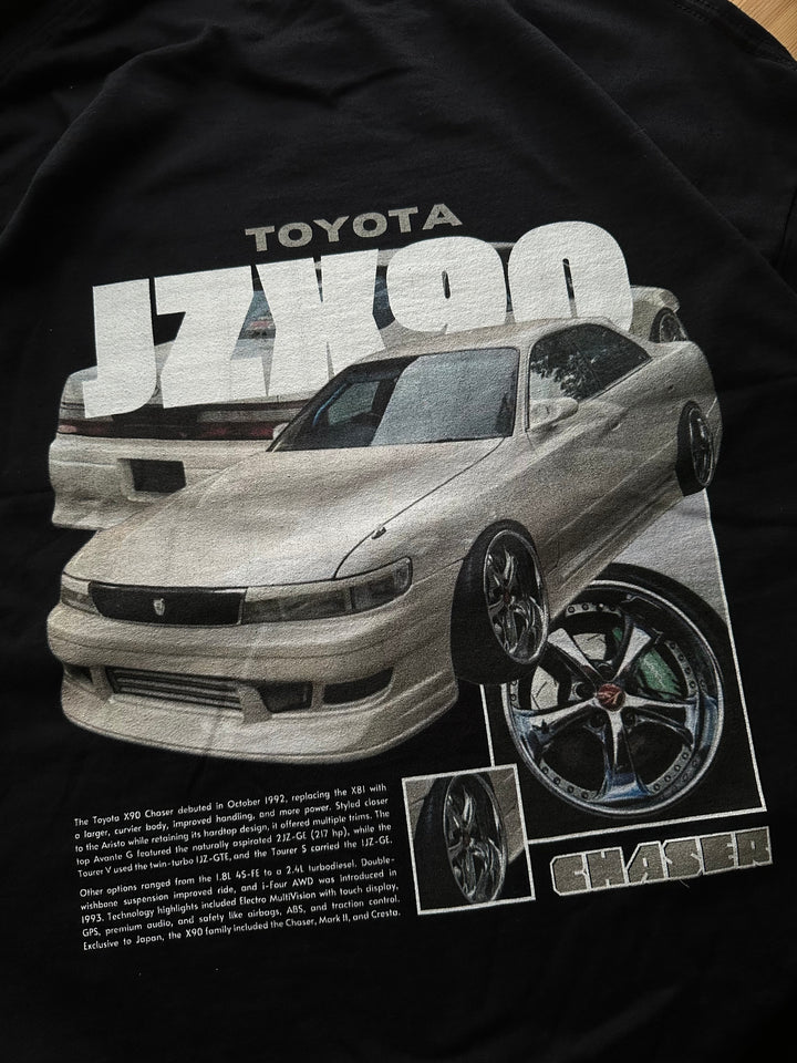 Black T-shirt with Toyota Chaser Jzx90 graphic on the back, picture of the rear, closeup of the graphic