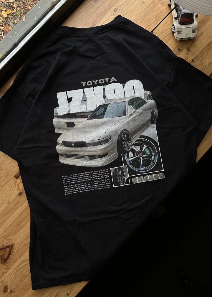 Black T-shirt with Toyota Chaser Jzx90 graphic on the back, picture of the rear, T-shirt on desk
