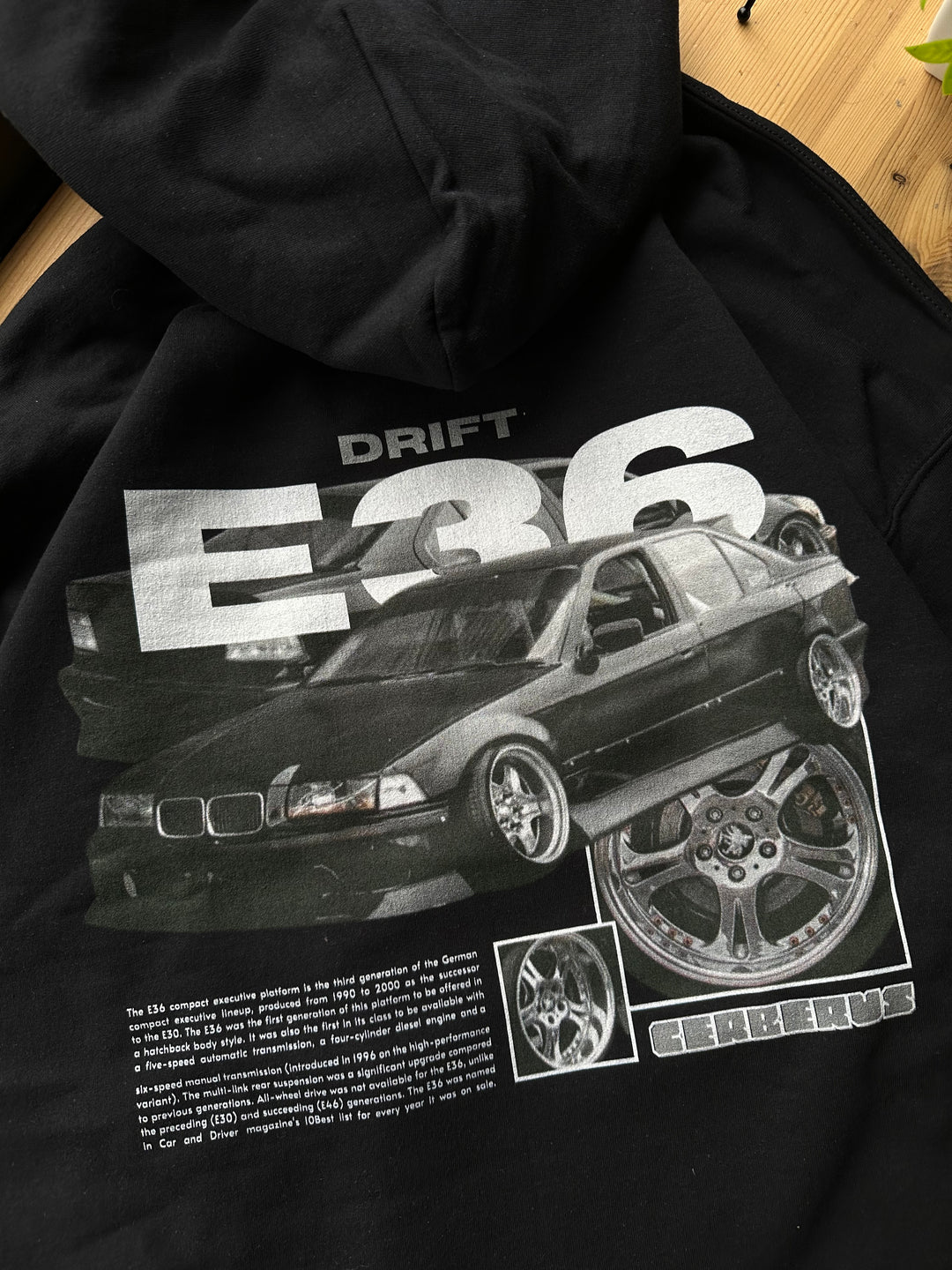 Black hoodie with Bmw E36 graphic on the back, picture of the rear, closeup of graphic