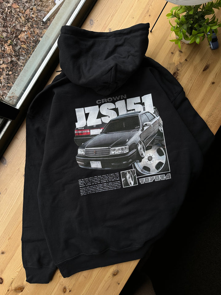 Black hoodie with Toyota Crown JZS151 graphic on the back, picture of the rear, hoodie on desk 