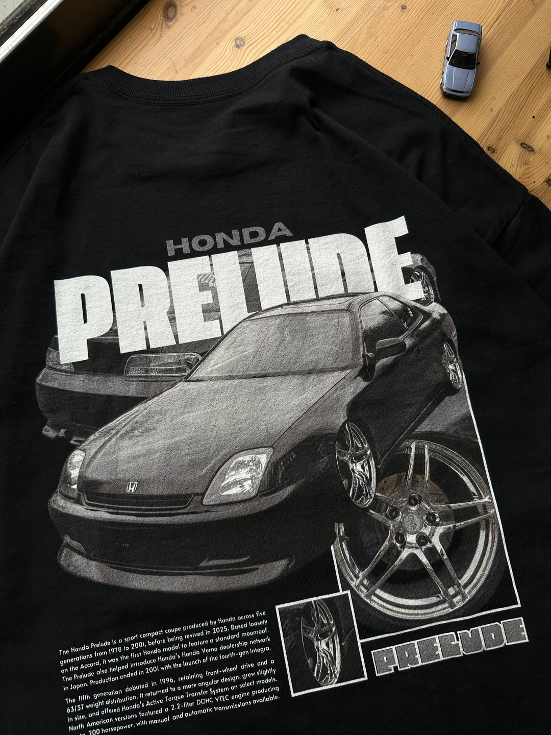 Black T-shirt with Honda Prelude BB9 graphic on the back, picture of the rear, closeup of the graphic