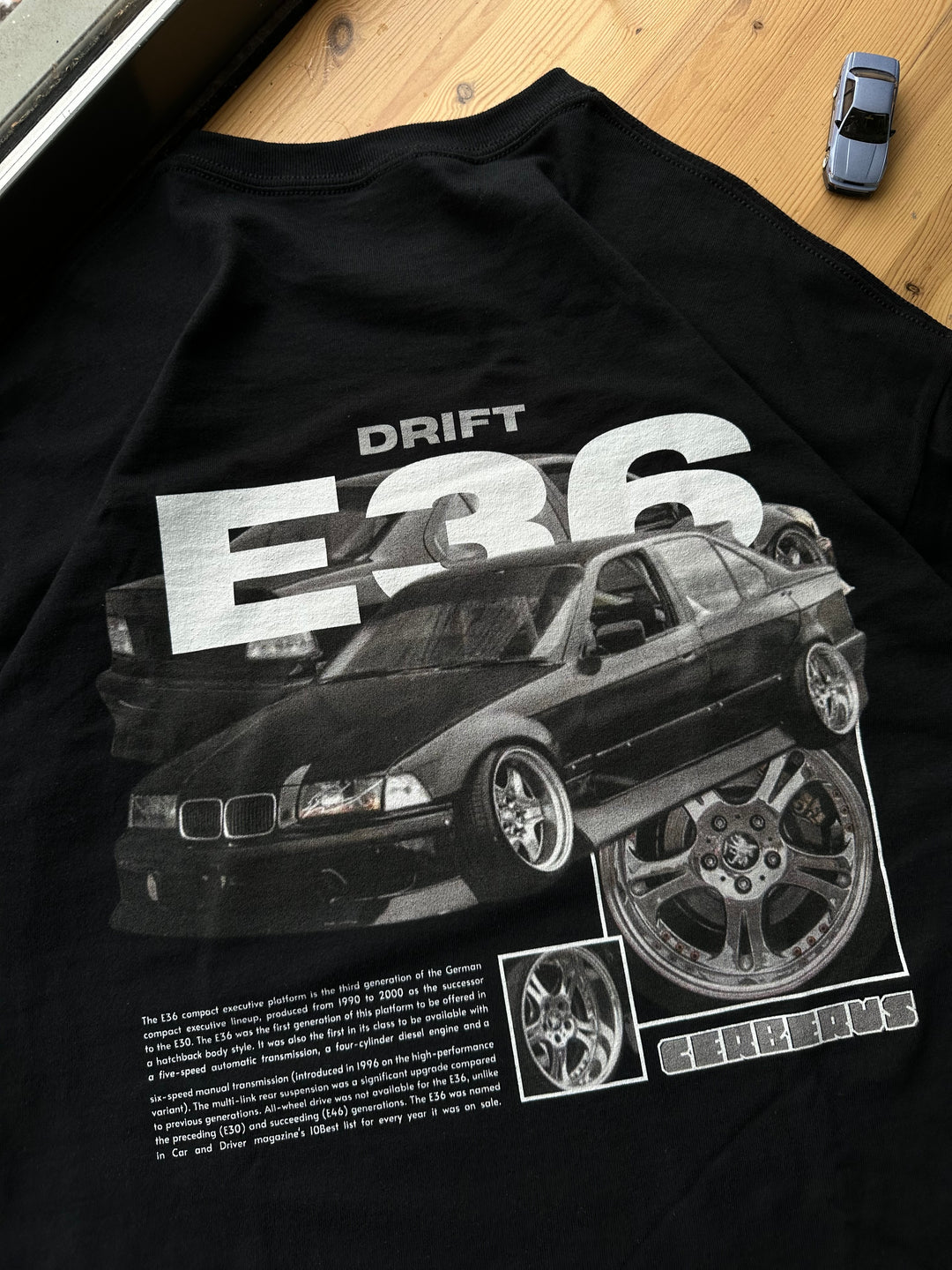 Black T-shirt with Bmw E36 graphic on the back, picture of the rear, closeup of the graphic