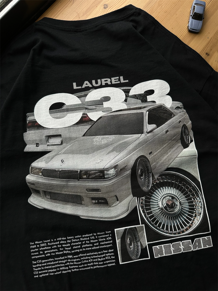 Black T-shirt with Nissan Laurel C33 graphic on the back, picture of the rear, closeup of graphic